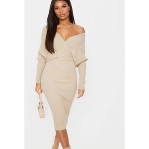 Off the shoulders nude sweater dress knit.